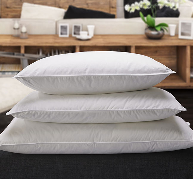 Three white pillows stacked