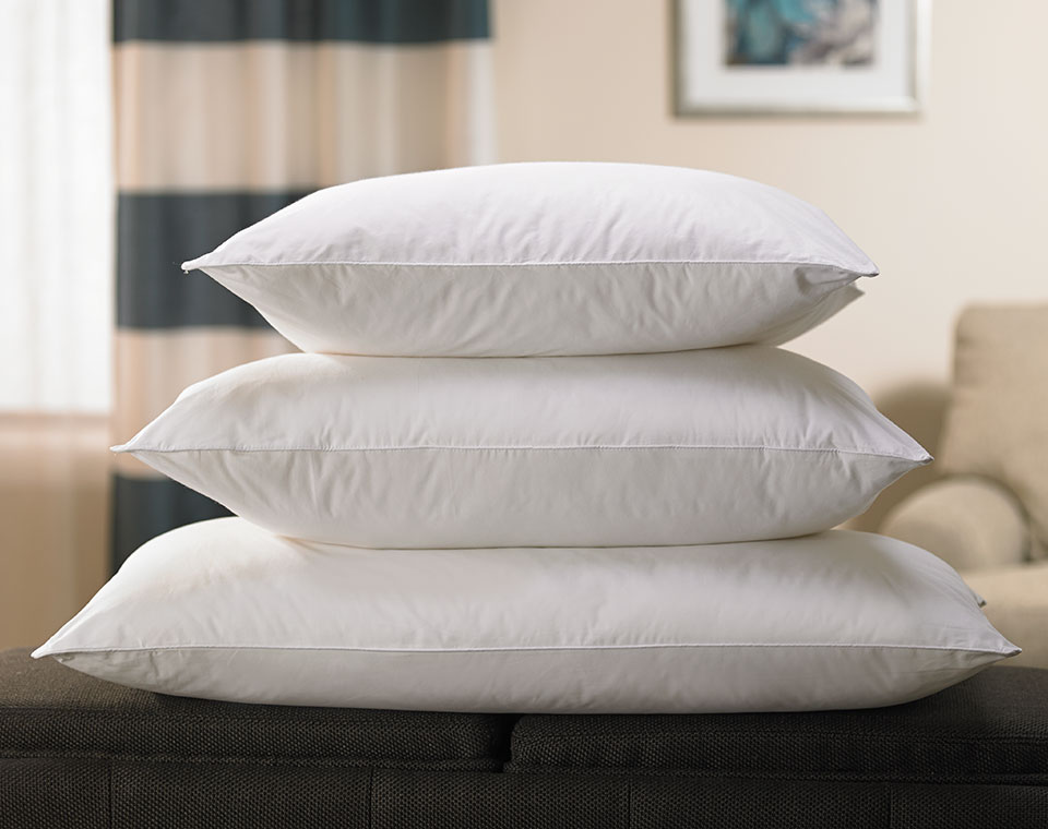 Three white pillows stacked