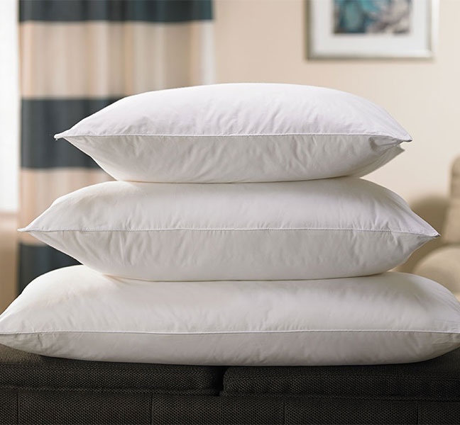 Three white pillows stacked