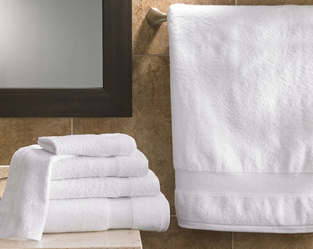 stack of towels in a bathroom dresser